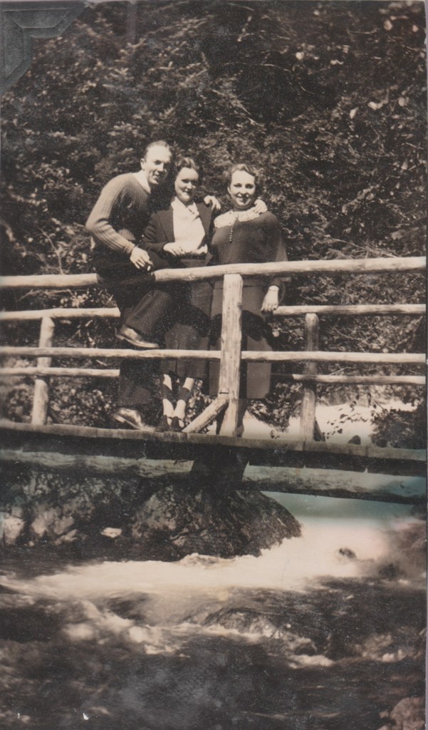 3 people on a bridge, 1937, Alaska