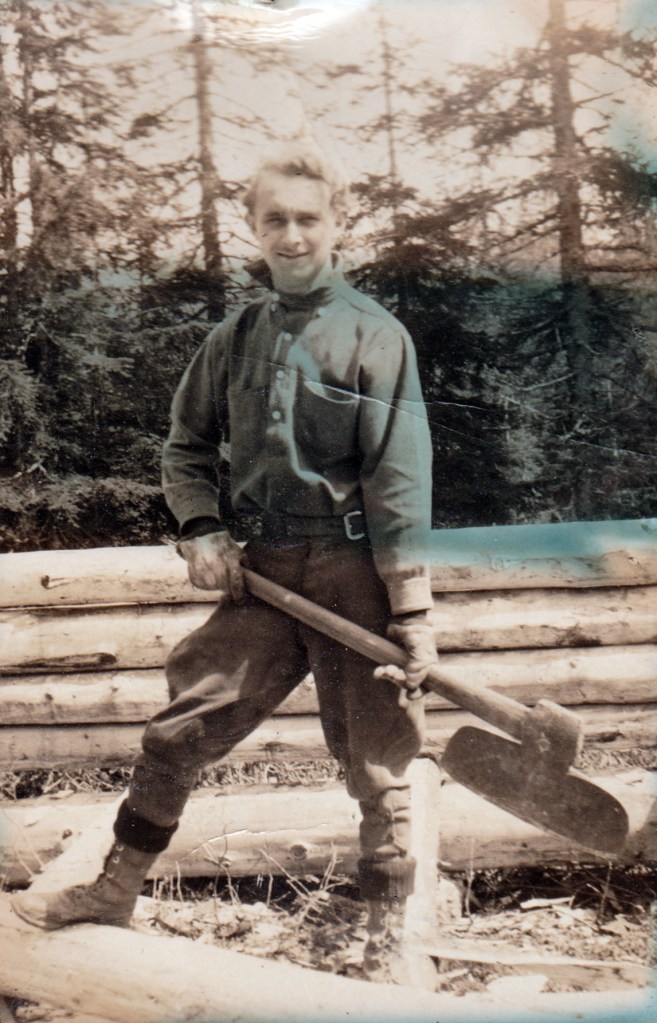 1932 man building cabin in Alaska